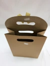 Wholesale of 260g creative kraft paper flip-top bow gift bags and fashionable handbags from the manufacturer Specification image